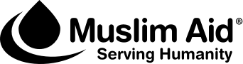 The logo features a black droplet shape followed by the text Muslim Aid® and below it, the tagline Serving Humanity, all on a light background.